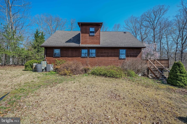 384 Meandering Ln, Hedgesville, WV 25427 - view of property exterior featuring a yard, stairway, a deck, and a shingled roof