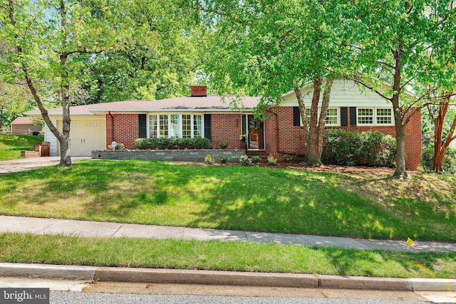 ranch-style home featuring driveway, a chimney, a garage, brick siding, and a front lawn