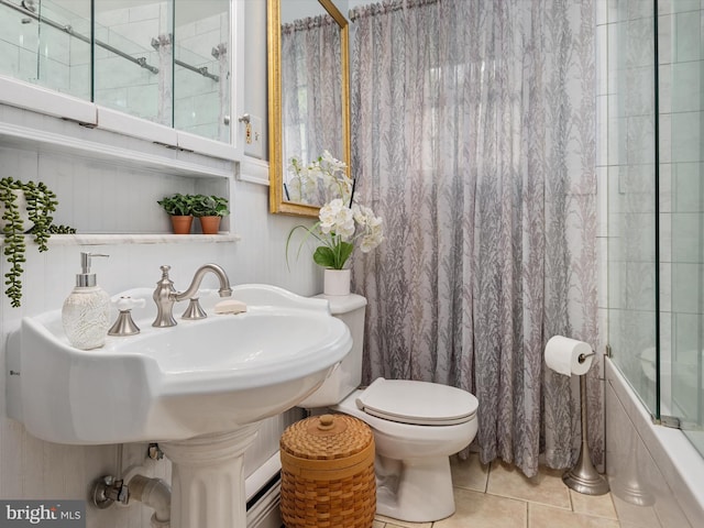 full bathroom featuring shower / bathtub combination, tile patterned flooring, and toilet