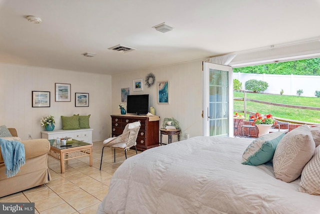 bedroom featuring access to exterior, light tile patterned flooring, and visible vents