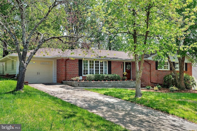 ranch-style house featuring brick siding, a garage, driveway, and a front yard