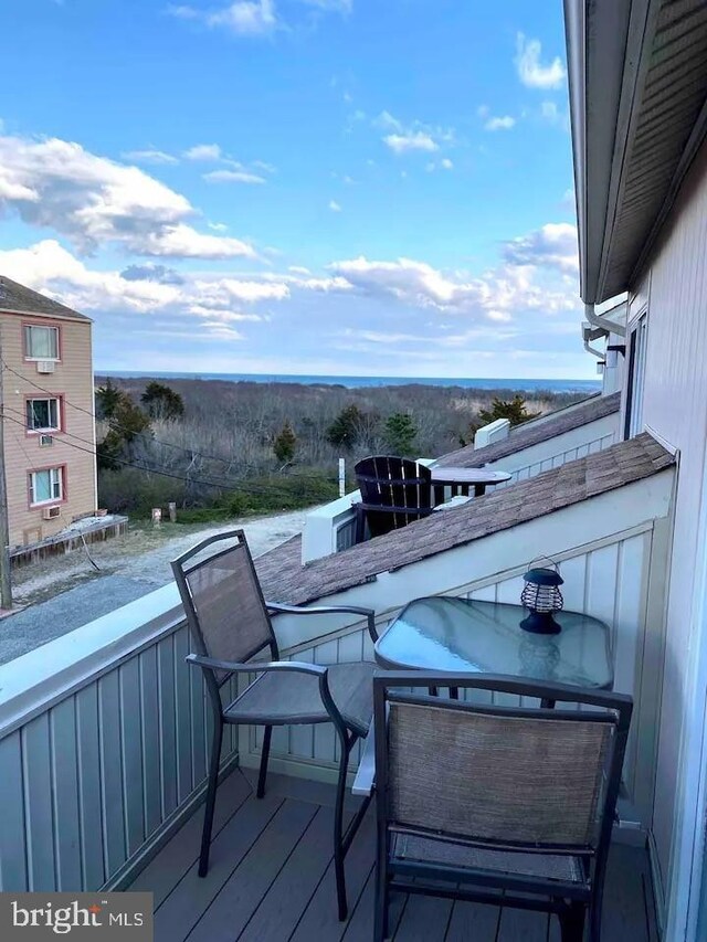 wooden terrace with a grill