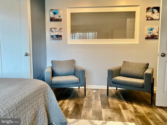 bedroom with wood finished floors