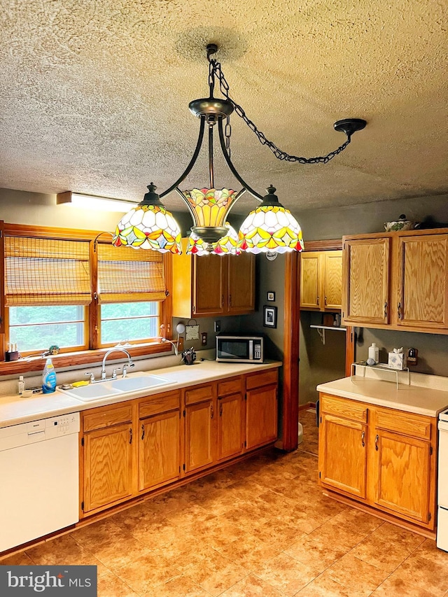 3080 Beautiful Run Rd, Orange, VA 22960 - kitchen with dishwasher, stainless steel microwave, a sink, a textured ceiling, and light countertops