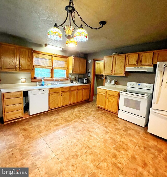 3080 Beautiful Run Rd, Orange, VA 22960 - kitchen with white appliances, under cabinet range hood, light countertops, decorative light fixtures, and a textured ceiling