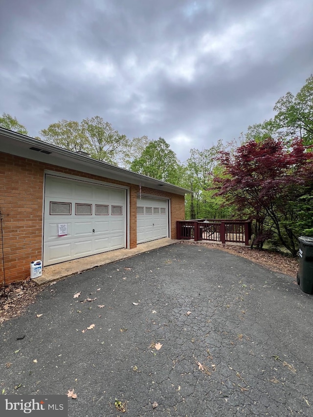 garage featuring driveway