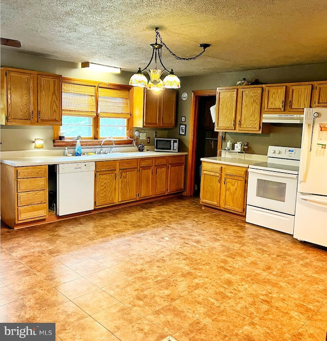 3080 Beautiful Run Rd, Orange, VA 22960 - kitchen featuring white appliances, under cabinet range hood, light countertops, and a textured ceiling