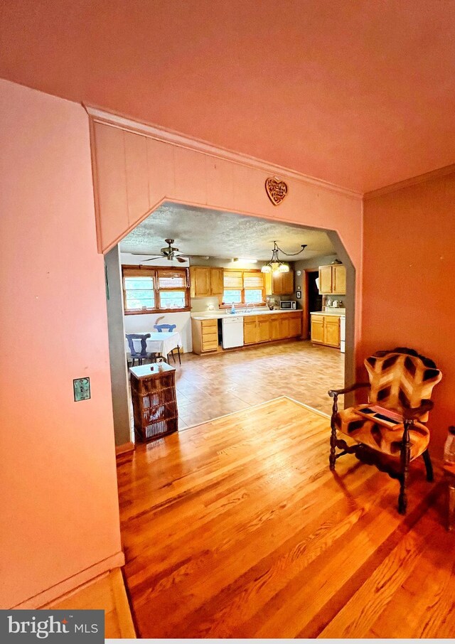 3080 Beautiful Run Rd, Orange, VA 22960 - living area with light wood-style flooring, ornamental molding, and arched walkways