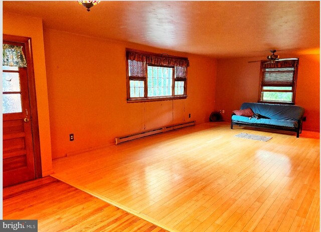 3080 Beautiful Run Rd, Orange, VA 22960 - unfurnished room with a baseboard heating unit, wood finished floors, and ceiling fan