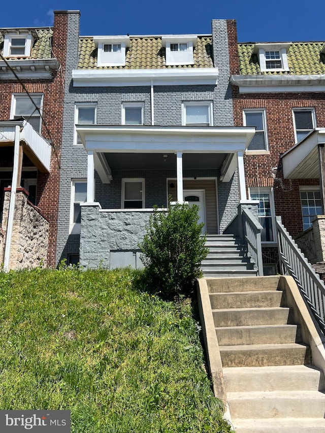 2519 Reisterstown Rd, Baltimore, MD 21217 - view of front of property featuring stairway, mansard roof, brick siding, and a high end roof