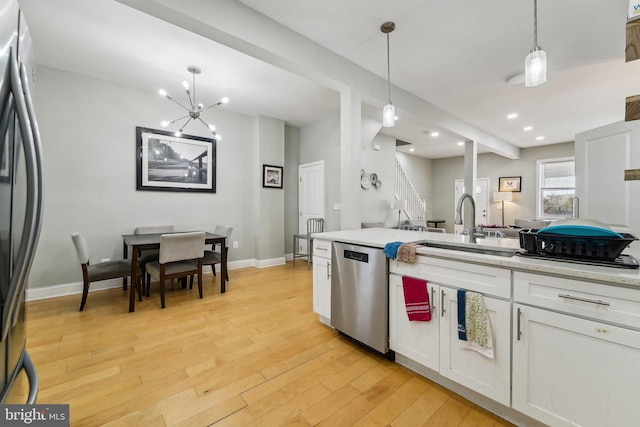 2519 Reisterstown Rd, Baltimore, MD 21217 - kitchen featuring stainless steel dishwasher, fridge, a sink, white cabinets, and recessed lighting