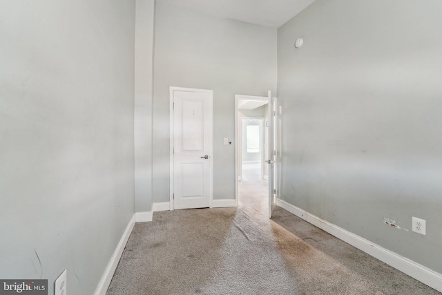 2519 Reisterstown Rd, Baltimore, MD 21217 - hallway featuring carpet floors, baseboards, and a high ceiling