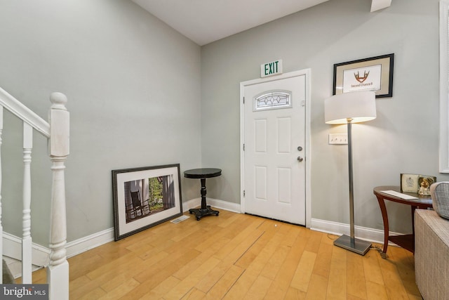 2519 Reisterstown Rd, Baltimore, MD 21217 - foyer entrance with baseboards, light wood-type flooring, and stairway