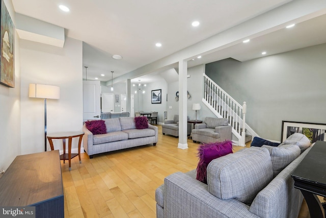2519 Reisterstown Rd, Baltimore, MD 21217 - living room with light wood-style floors, stairway, and recessed lighting
