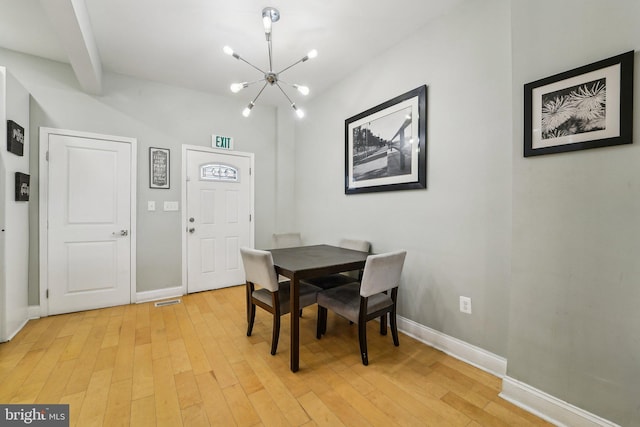 2519 Reisterstown Rd, Baltimore, MD 21217 - dining area featuring a chandelier, baseboards, and light wood finished floors