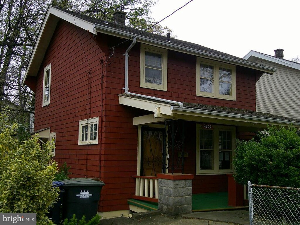 2809 Myrtle Ave NE, Washington, DC 20018 - exterior space with a chimney, covered porch, and fence