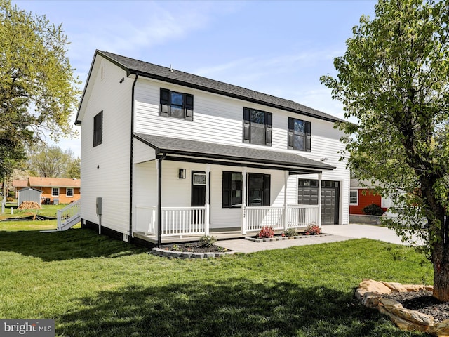 back of house featuring a lawn, driveway, a garage, and covered porch