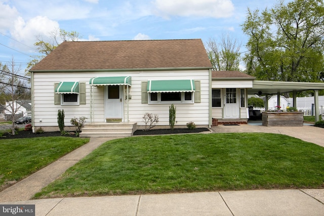 78 Carr Ave, Lawrenceville, NJ 08648 - view of front facade with roof with shingles, a front lawn, driveway, and an attached carport
