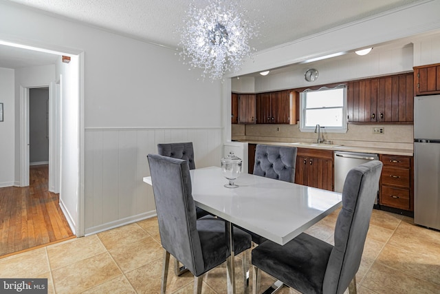 78 Carr Ave, Lawrenceville, NJ 08648 - dining room with a textured ceiling, a chandelier, and wainscoting