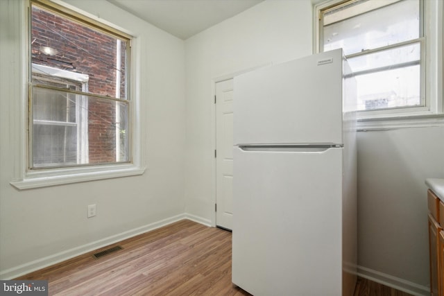 5449 Race St, Philadelphia, PA 19139 - interior space featuring visible vents, baseboards, and wood finished floors