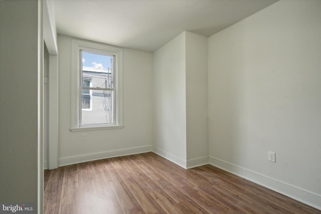 5449 Race St, Philadelphia, PA 19139 - spare room with baseboards and wood finished floors