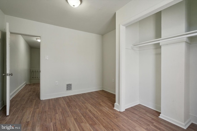 5449 Race St, Philadelphia, PA 19139 - unfurnished bedroom featuring visible vents, a closet, baseboards, and wood finished floors