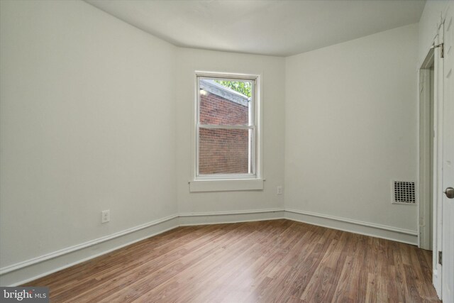 5449 Race St, Philadelphia, PA 19139 - unfurnished bedroom with visible vents, baseboards, and wood finished floors