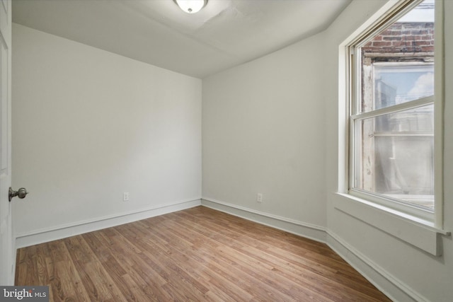 5449 Race St, Philadelphia, PA 19139 - empty room featuring a wealth of natural light, wood finished floors, and baseboards