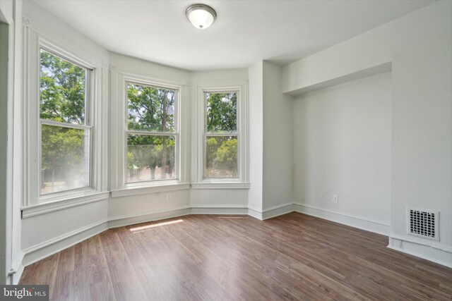 5449 Race St, Philadelphia, PA 19139 - unfurnished room with plenty of natural light, visible vents, and wood finished floors
