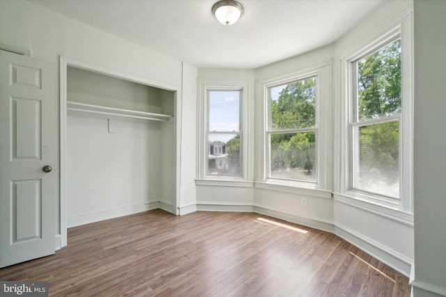 5449 Race St, Philadelphia, PA 19139 - unfurnished bedroom with a closet, baseboards, and wood finished floors