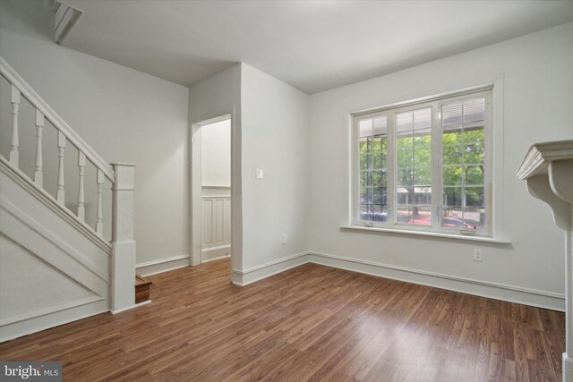 5449 Race St, Philadelphia, PA 19139 - unfurnished living room with stairs, baseboards, and wood finished floors