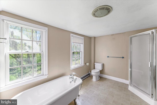 full bath with visible vents, toilet, baseboards, a freestanding tub, and a stall shower