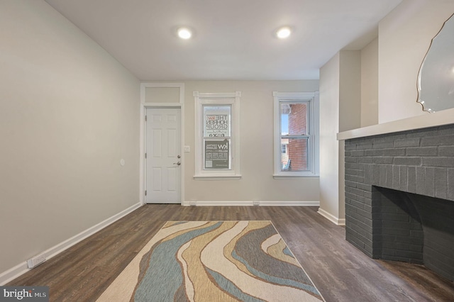 424 S Van Buren St, Wilmington, DE 19805 - unfurnished living room featuring wood finished floors, baseboards, a brick fireplace, and recessed lighting