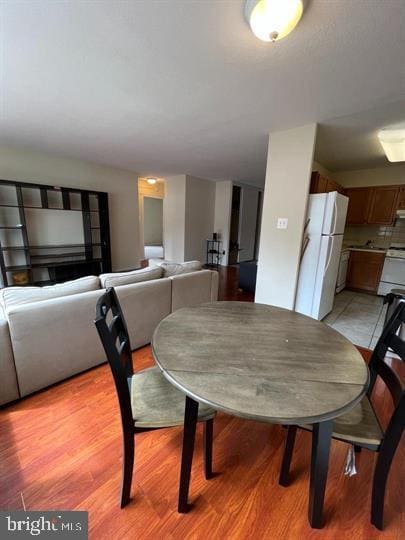 dining area with light wood finished floors