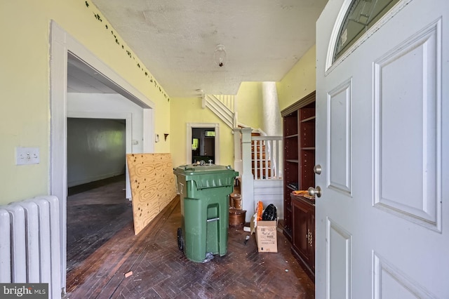 foyer entrance with radiator and parquet floors