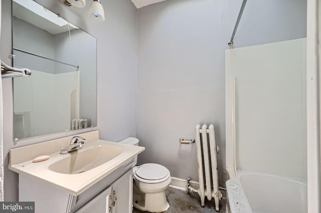 bathroom with toilet, radiator, vanity, and shower / washtub combination