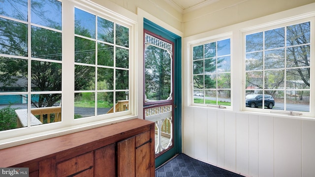 unfurnished sunroom featuring plenty of natural light