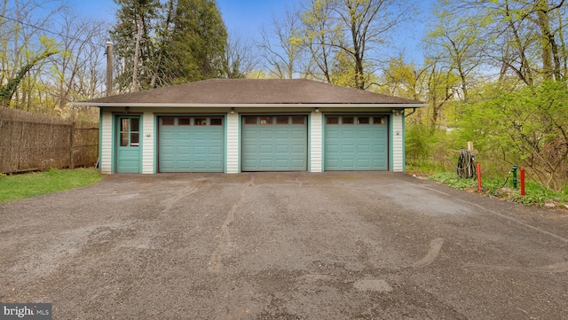 detached garage with fence