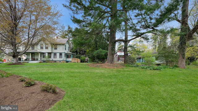 view of yard with a porch