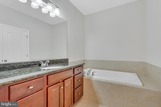 42482 Benfold Sq, Ashburn, VA 20148 - full bathroom featuring vanity, a bath, and tile patterned floors