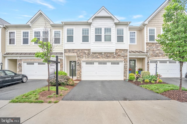 42482 Benfold Sq, Ashburn, VA 20148 - townhome / multi-family property featuring stone siding, driveway, and a garage