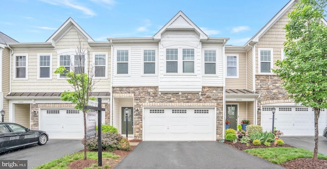 42482 Benfold Sq, Ashburn, VA 20148 - view of property with stone siding, driveway, and a garage