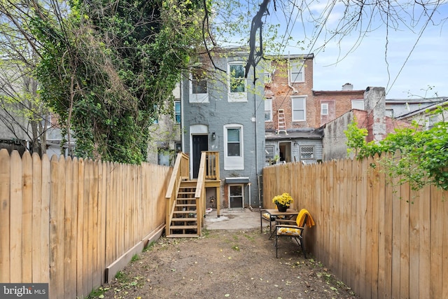 rear view of house with fence
