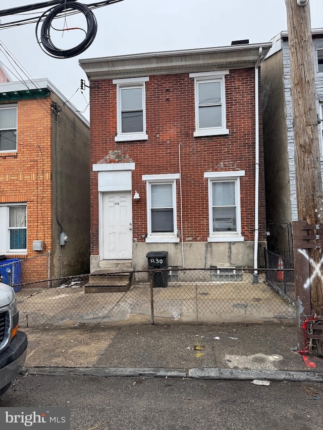 1230adams Adams, Philadelphia, PA 19124 - view of front of house featuring brick siding, entry steps, and a fenced front yard