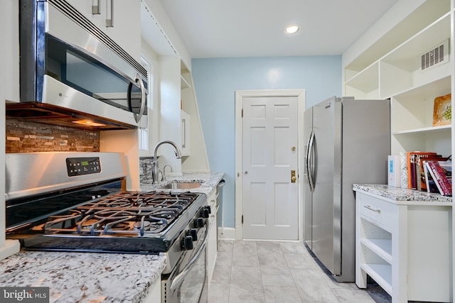 1122 Bellemore Rd, Baltimore, MD 21210 - kitchen featuring tasteful backsplash, white cabinetry, open shelves, a sink, and stainless steel appliances