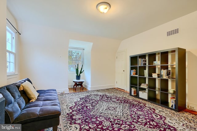 1122 Bellemore Rd, Baltimore, MD 21210 - living area with visible vents, baseboards, and wood finished floors