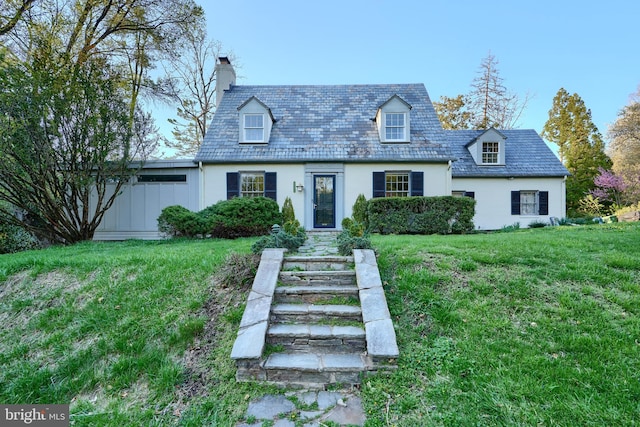 1122 Bellemore Rd, Baltimore, MD 21210 - cape cod-style house with a front yard and a chimney