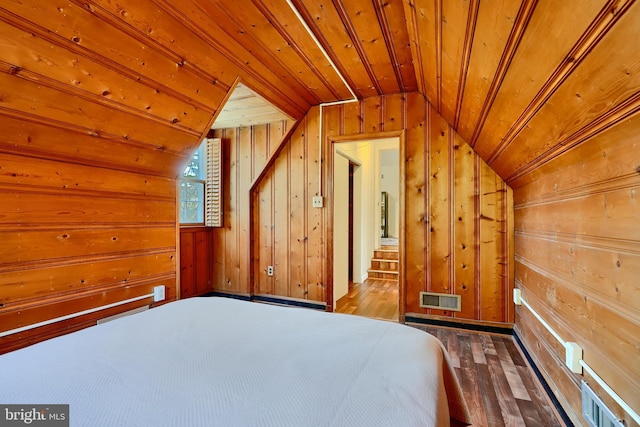 1122 Bellemore Rd, Baltimore, MD 21210 - bedroom with vaulted ceiling, wood walls, visible vents, hardwood / wood-style flooring, and wooden ceiling