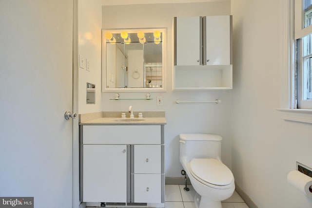 1122 Bellemore Rd, Baltimore, MD 21210 - bathroom with toilet, vanity, baseboards, and tile patterned flooring