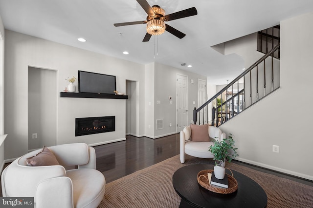 living area featuring ceiling fan, stairs, recessed lighting, wood finished floors, and visible vents